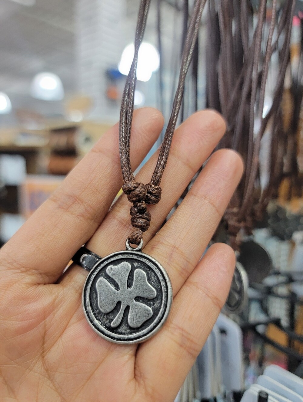 Round Silver Clover Pendant Necklace on Brown Cord